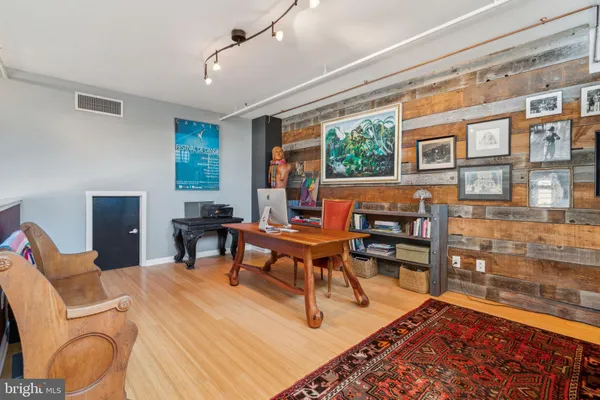 a living room with furniture pool table and a large window