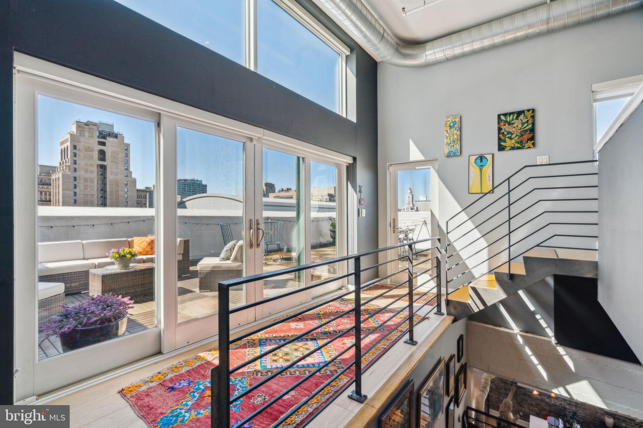 1228 Arch Street, Unit 8A Philadelphia, PA 19107 - Photo 28 of 44 Wall of glass to the private terrace-west facing