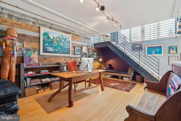 a view of entryway dining room and hall with wooden floor