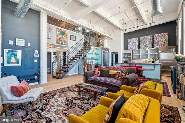 a living room with lots of furniture and a rug
