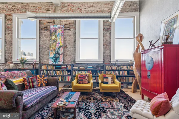 a reading room with furniture and rug