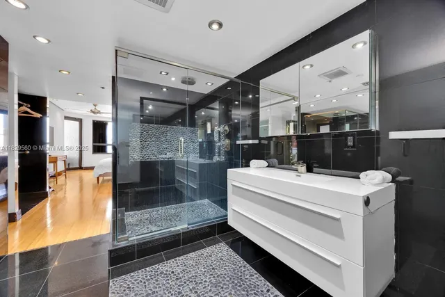 a large white kitchen with a large window