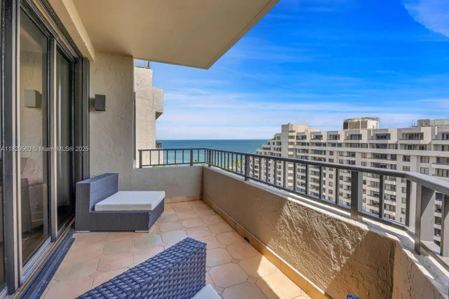 a view of balcony with furniture