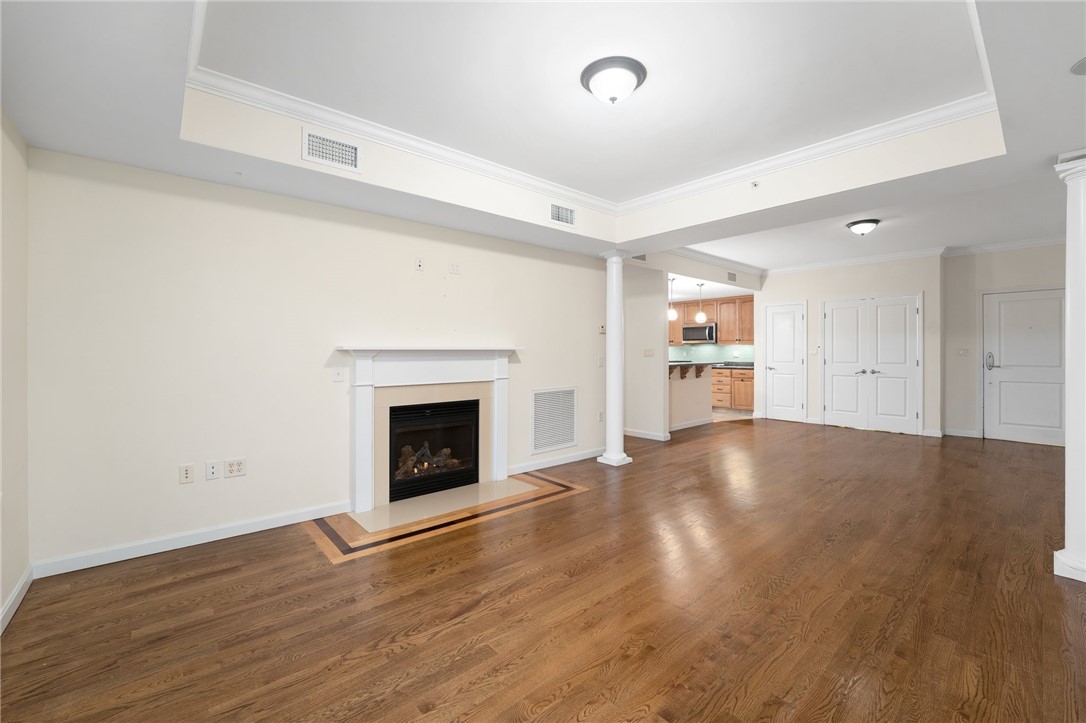 114 Granite Street, Unit 208 Westerly, RI 02891 - Photo 9 of 39 Virtually staged living room dining area kitchen