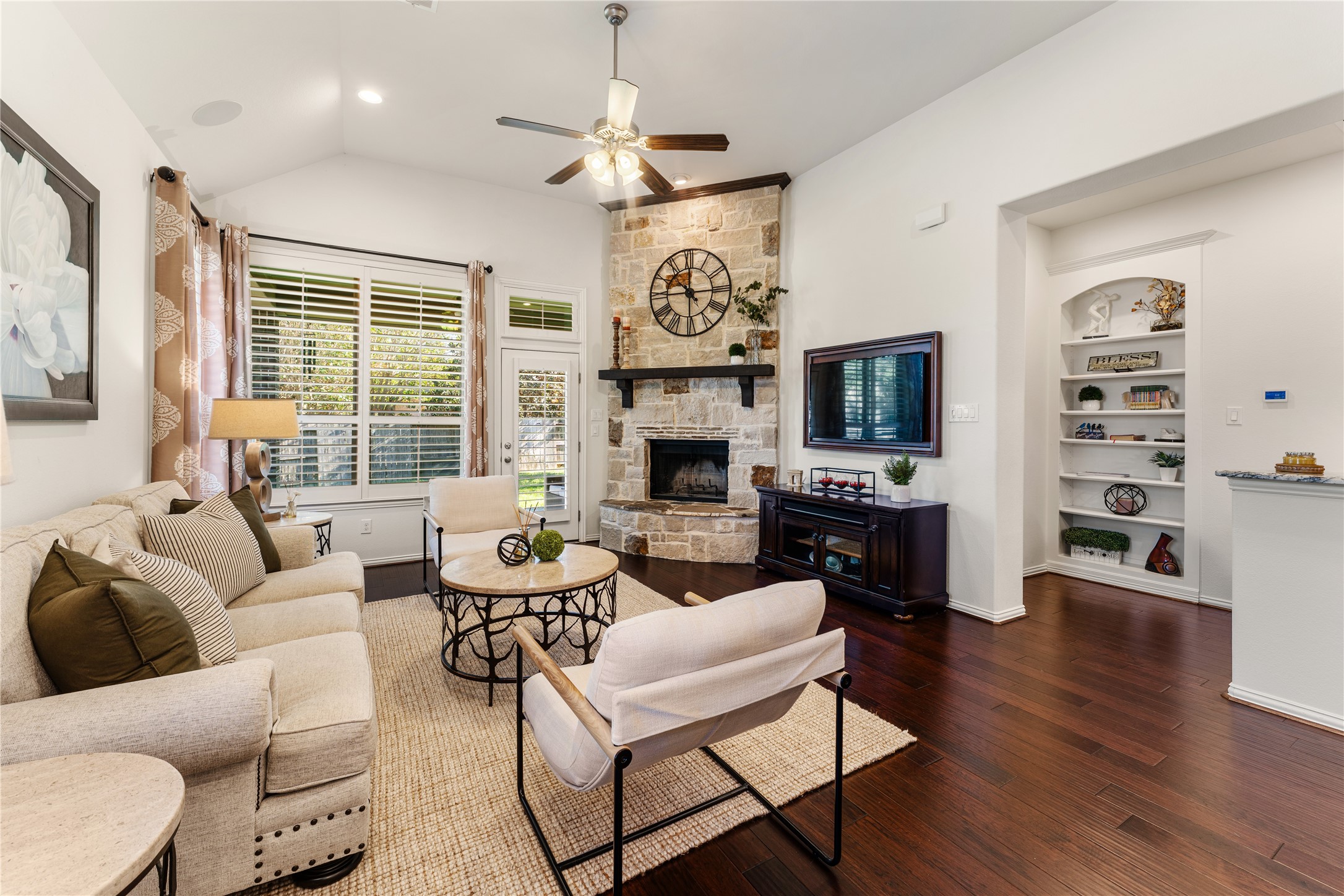 6014 Barrett Cove Court Richmond, TX 77407 - Photo 1 of 45 a living room with fireplace furniture and a wooden floor