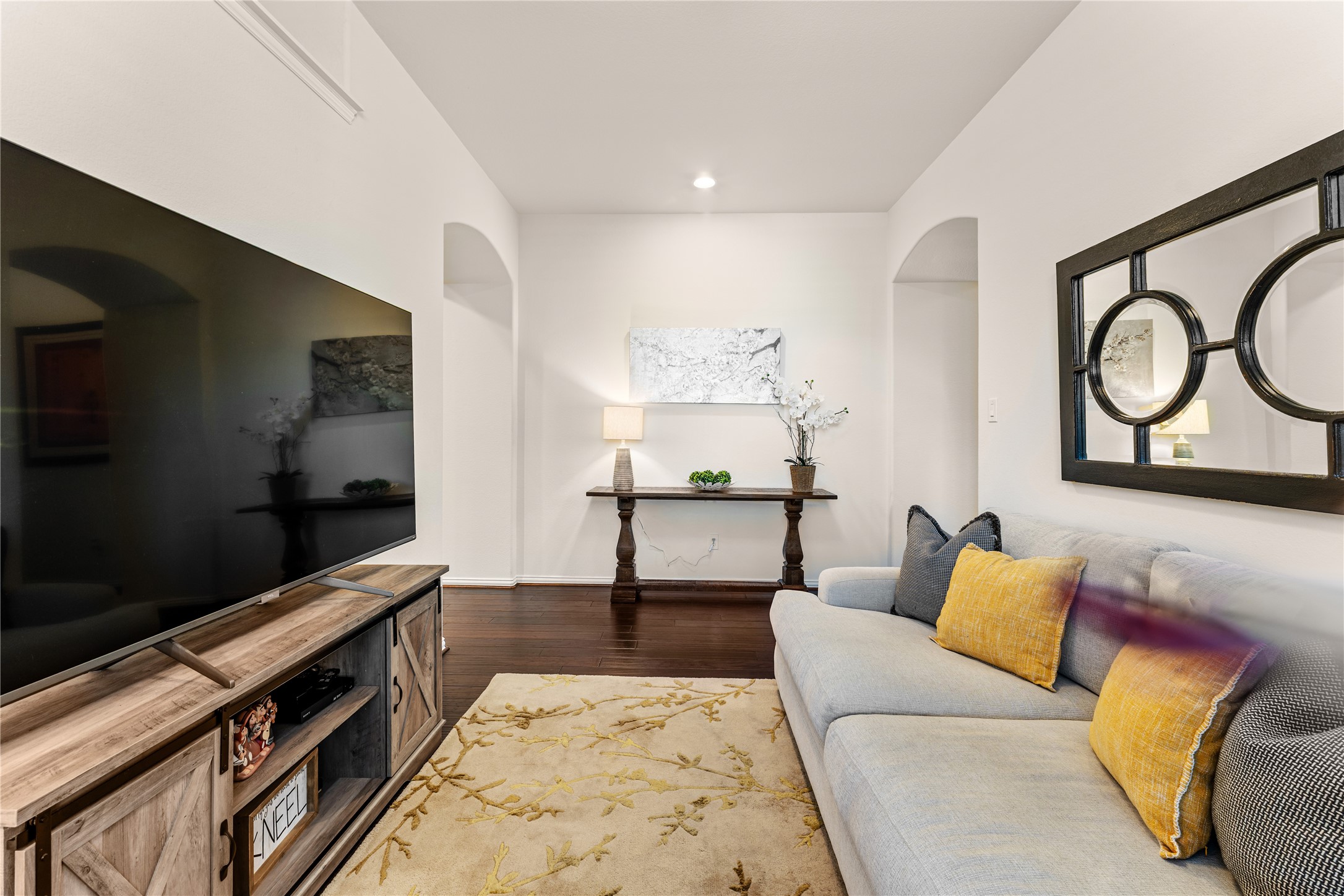 6014 Barrett Cove Court Richmond, TX 77407 - Photo 11 of 45 a living room with furniture and a flat screen tv