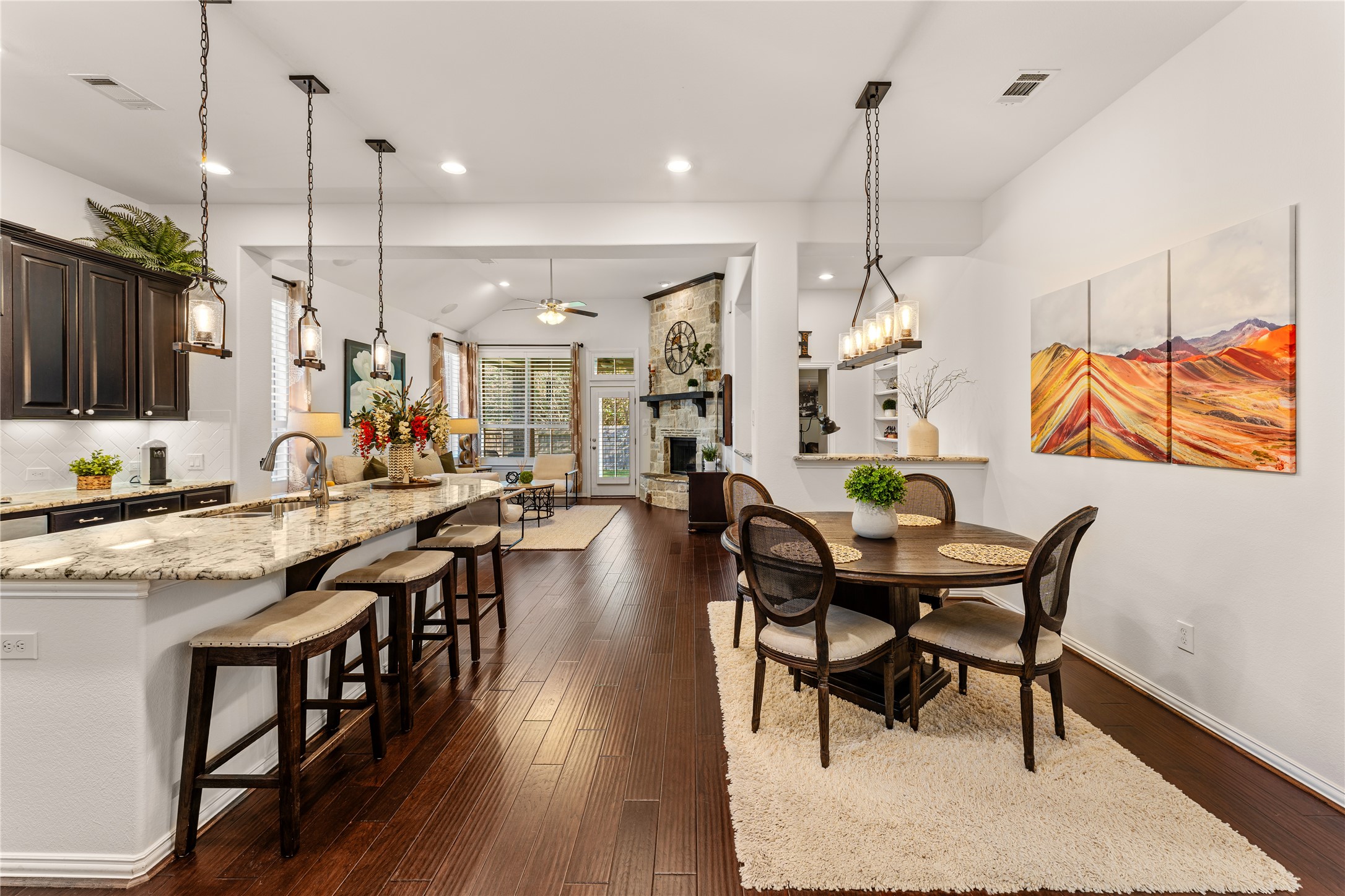 6014 Barrett Cove Court Richmond, TX 77407 - Photo 12 of 45 a dining table chairs wooden floor and a chandelier