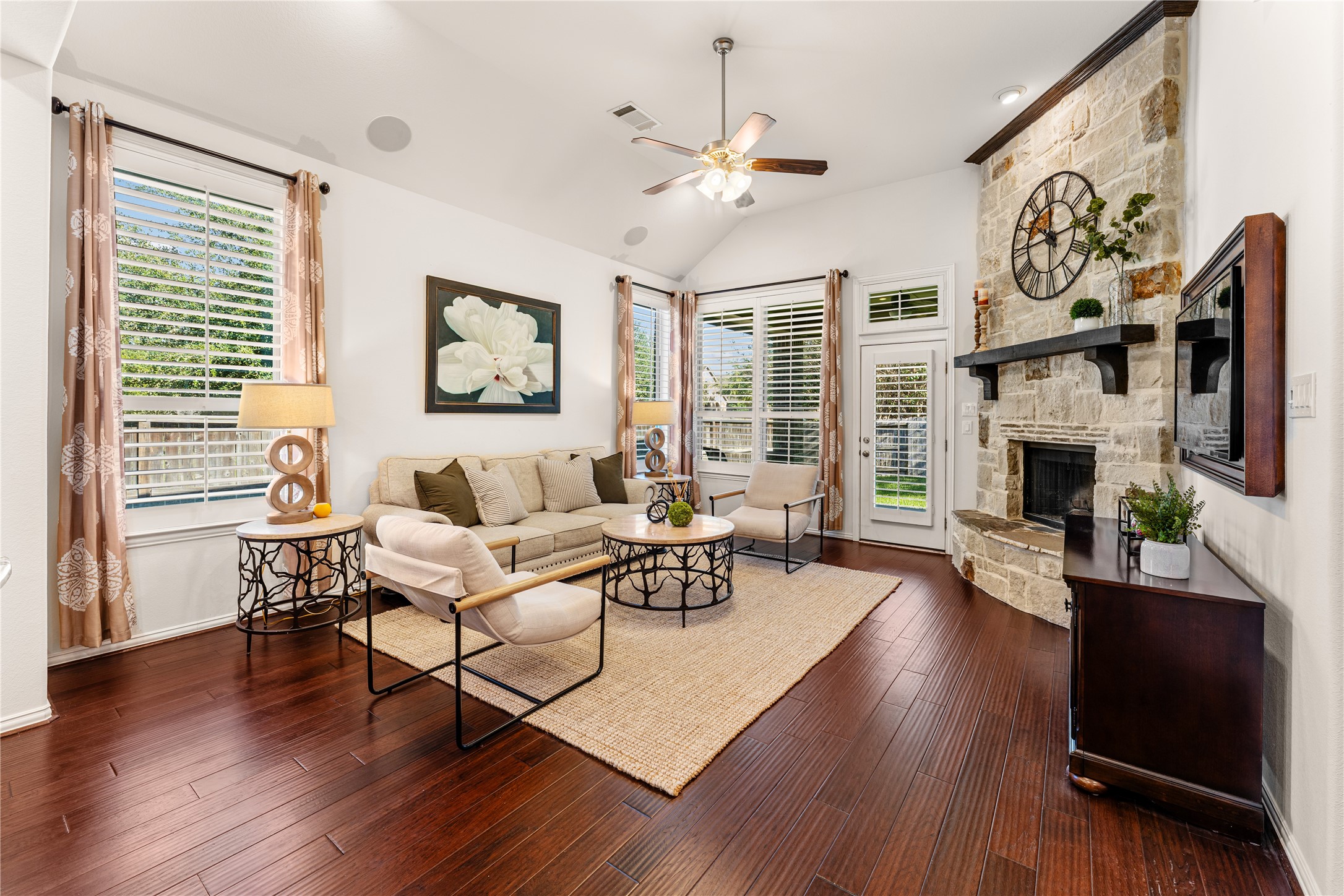 6014 Barrett Cove Court Richmond, TX 77407 - Photo 21 of 45 a living room with fireplace furniture and a wooden floor