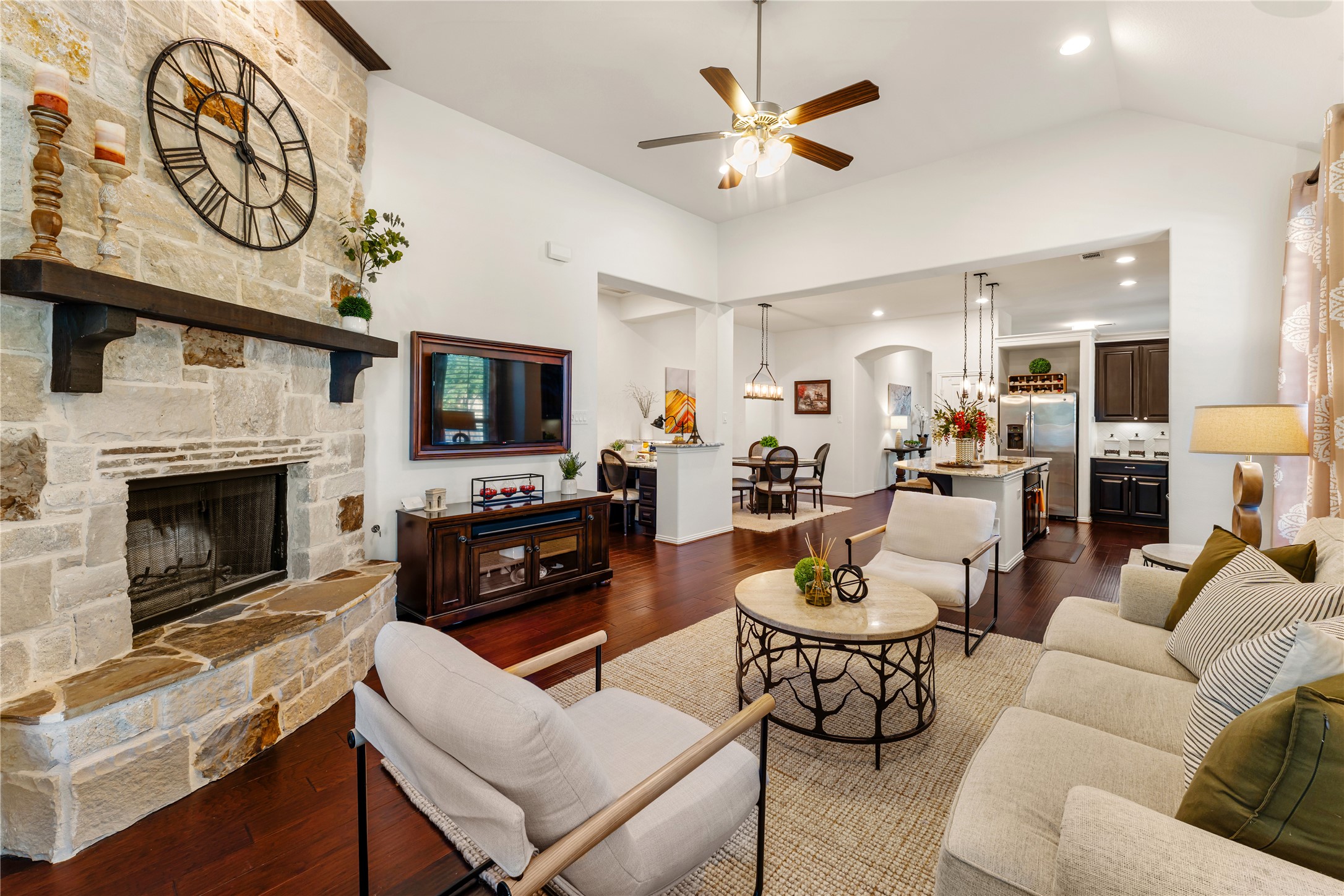 6014 Barrett Cove Court Richmond, TX 77407 - Photo 23 of 45 a living room with furniture a fireplace and a flat screen tv
