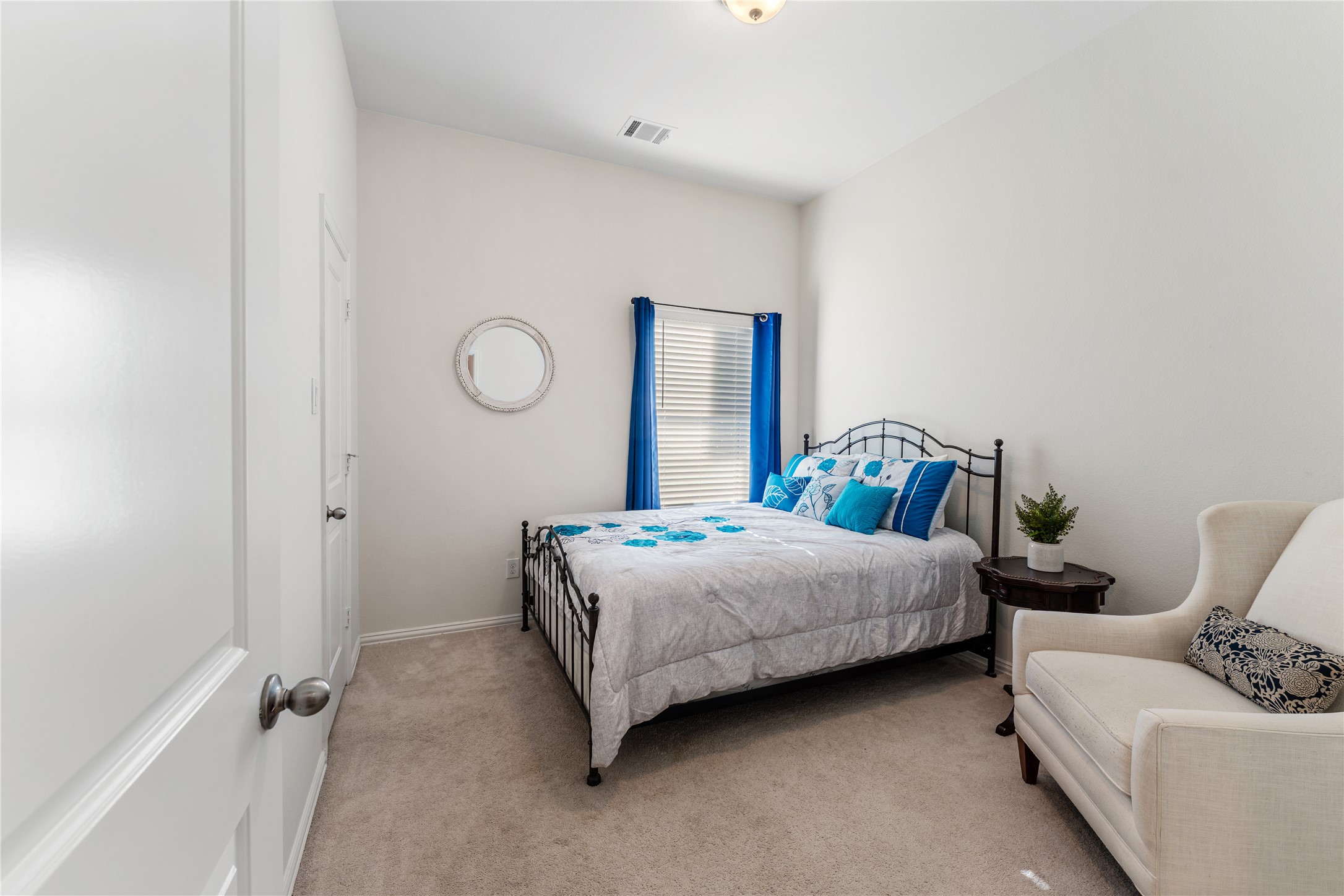 6014 Barrett Cove Court Richmond, TX 77407 - Photo 33 of 45 a bedroom with a bed and window