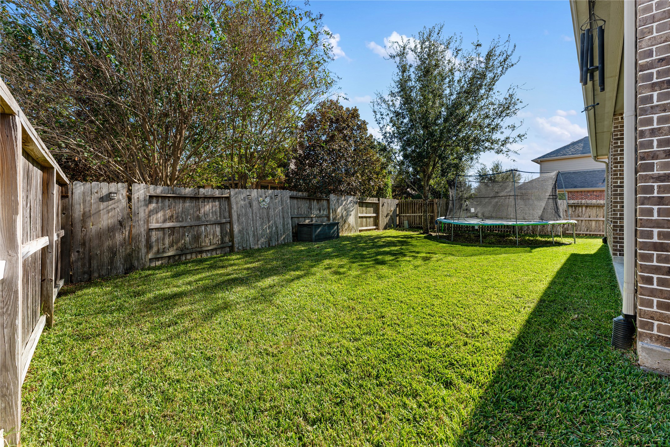 6014 Barrett Cove Court Richmond, TX 77407 - Photo 40 of 45 a view of a backyard with a garden