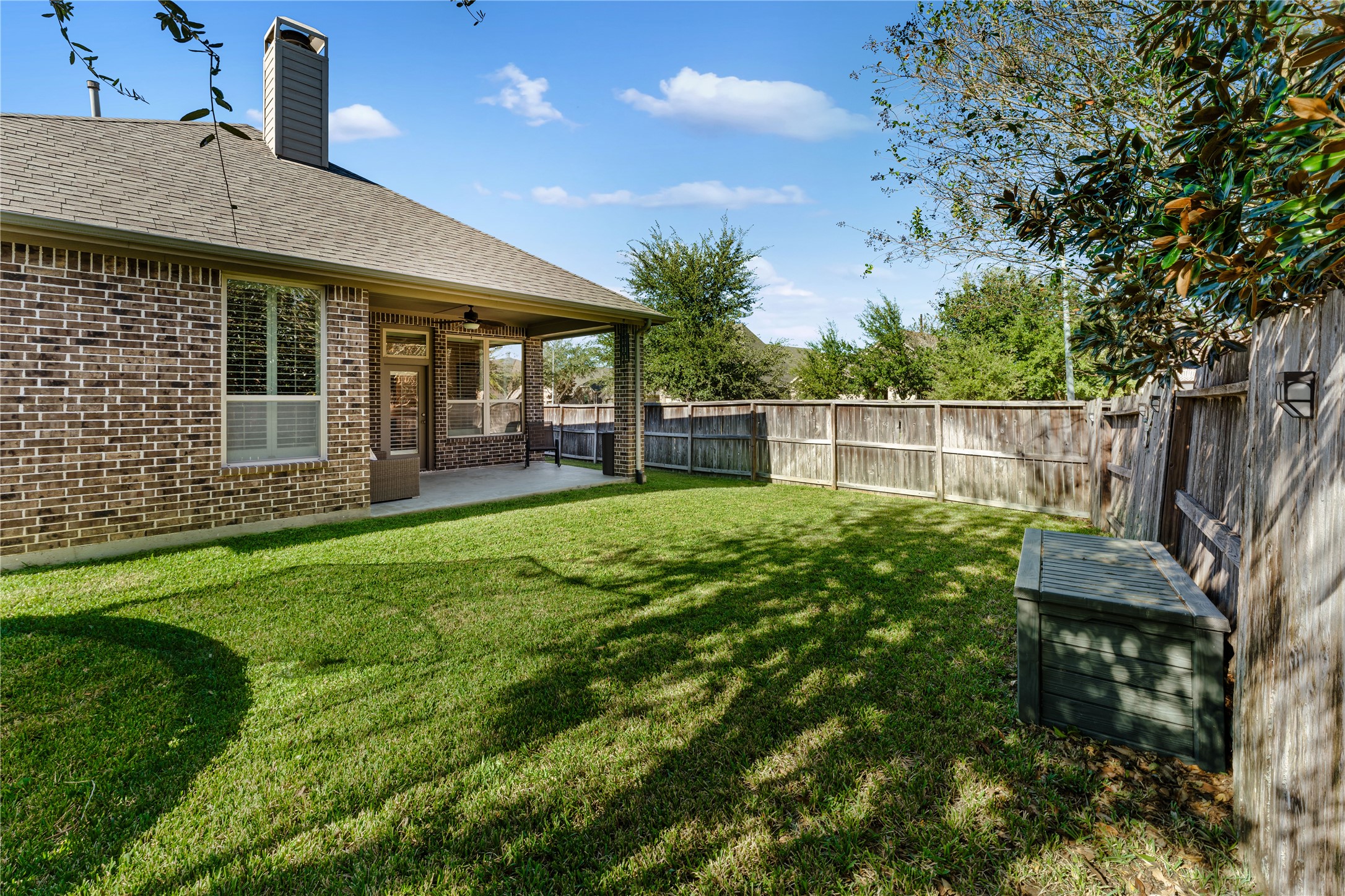 6014 Barrett Cove Court Richmond, TX 77407 - Photo 42 of 45 a view of a house with a backyard