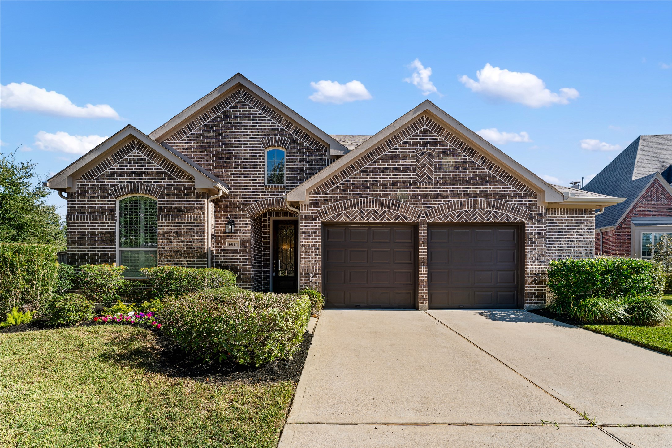 6014 Barrett Cove Court Richmond, TX 77407 - Photo 44 of 45 a view of a house with a yard and potted plants