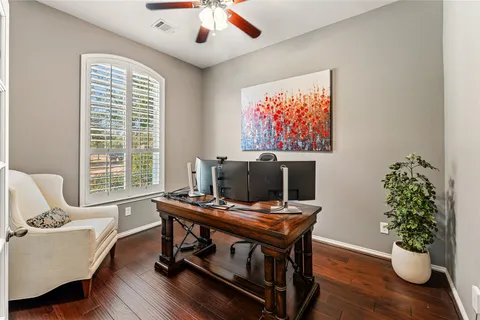 a workspace with furniture and a potted plant
