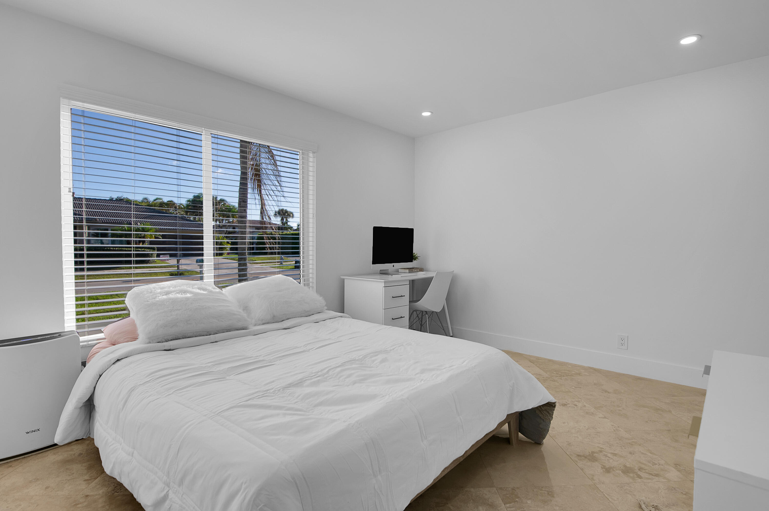 1499 Southwest 20th Street Boca Raton, FL 33486 - Photo 33 of 82 a bedroom with a bed and a flat screen tv