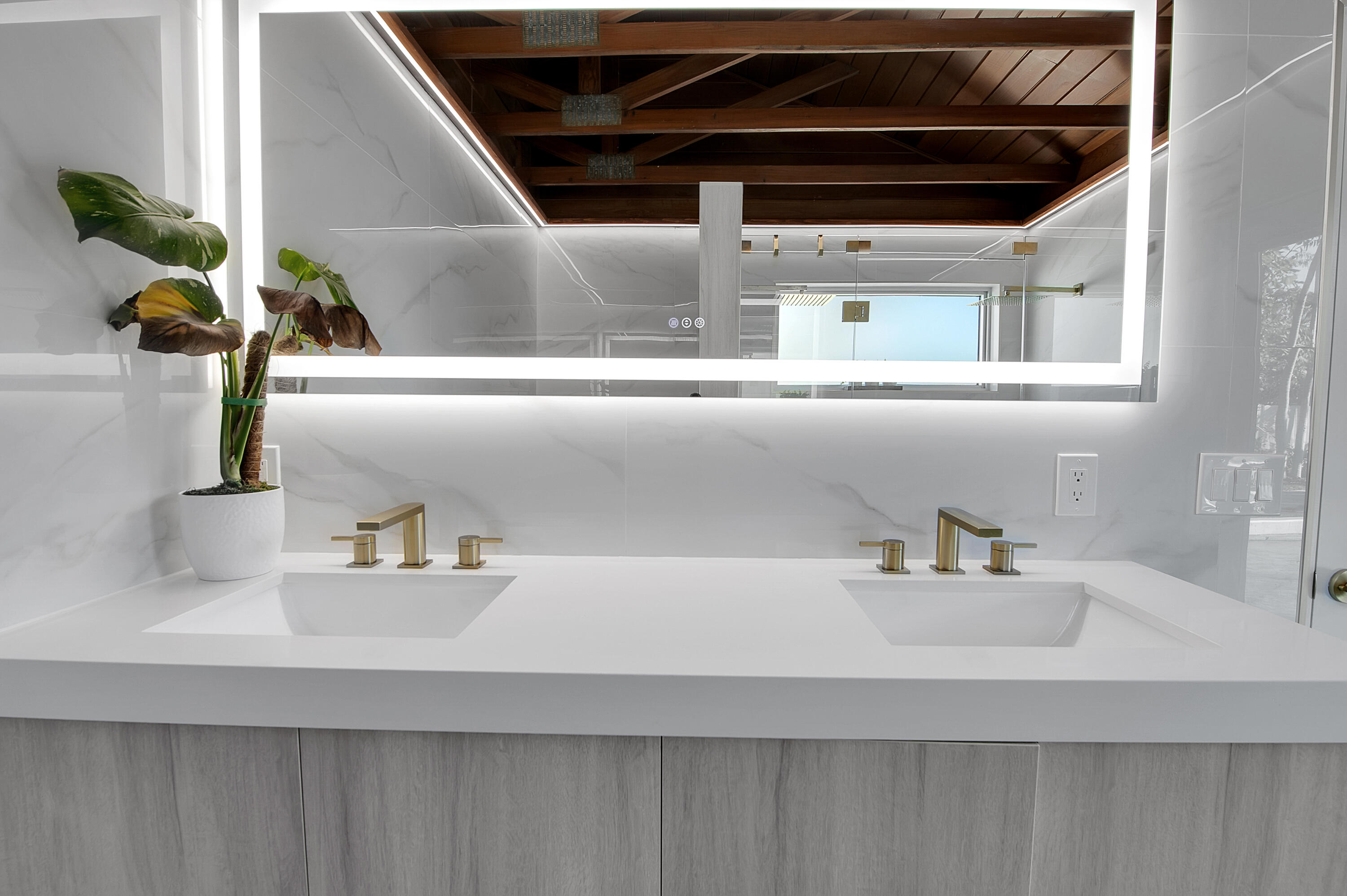 1499 Southwest 20th Street Boca Raton, FL 33486 - Photo 54 of 82 a kitchen with a sink and a potted plant
