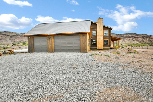544 East 600 North, Unit 1 Joseph, UT 84739 - Photo 40 of 65 Two-car garage with wood siding and a metal roof