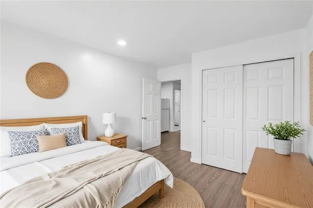 a white toilet sitting next to a bathroom sink