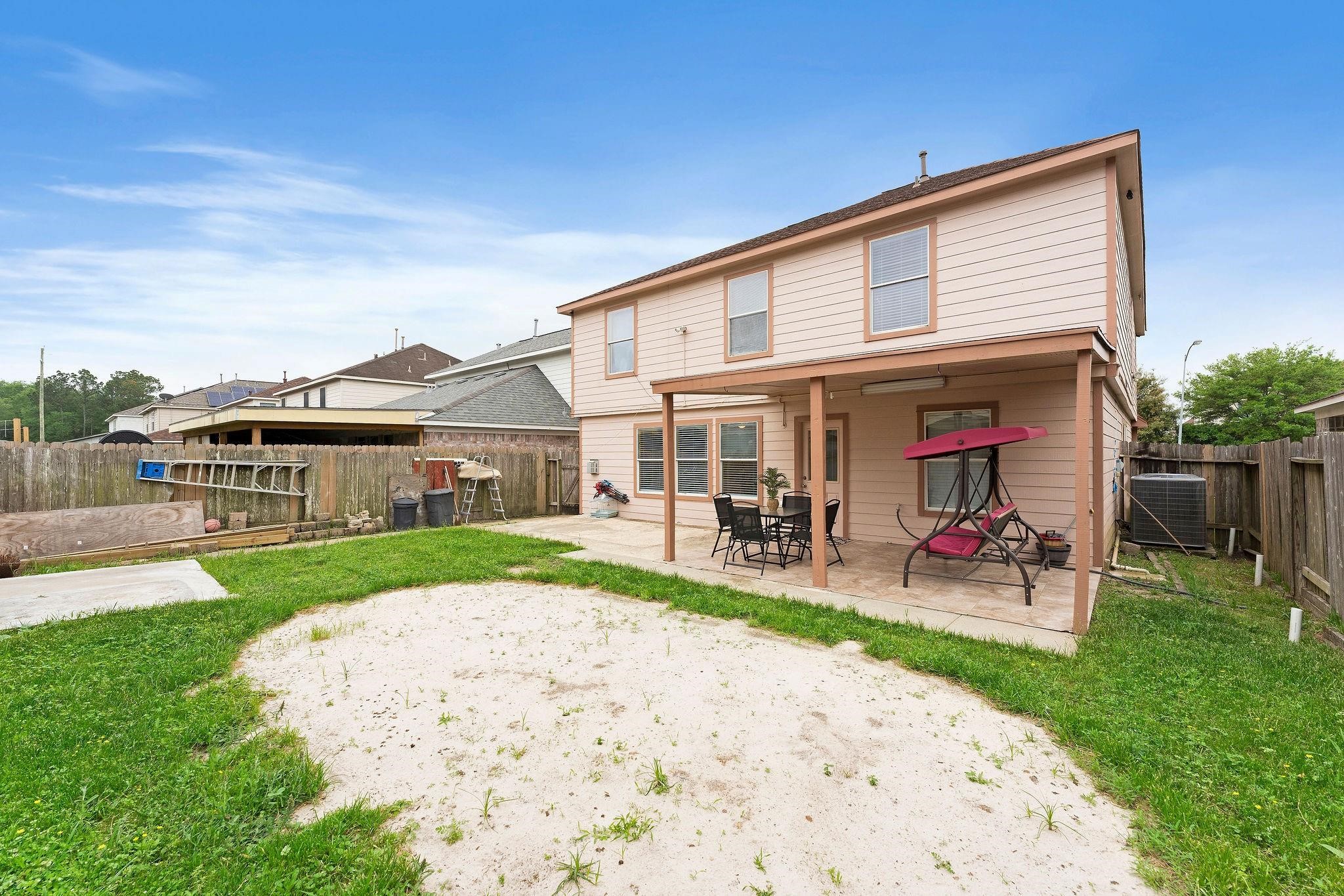 11622 Silent Elm Street Houston, TX 77044 - Photo 2 of 5 a view of house with a garden and patio