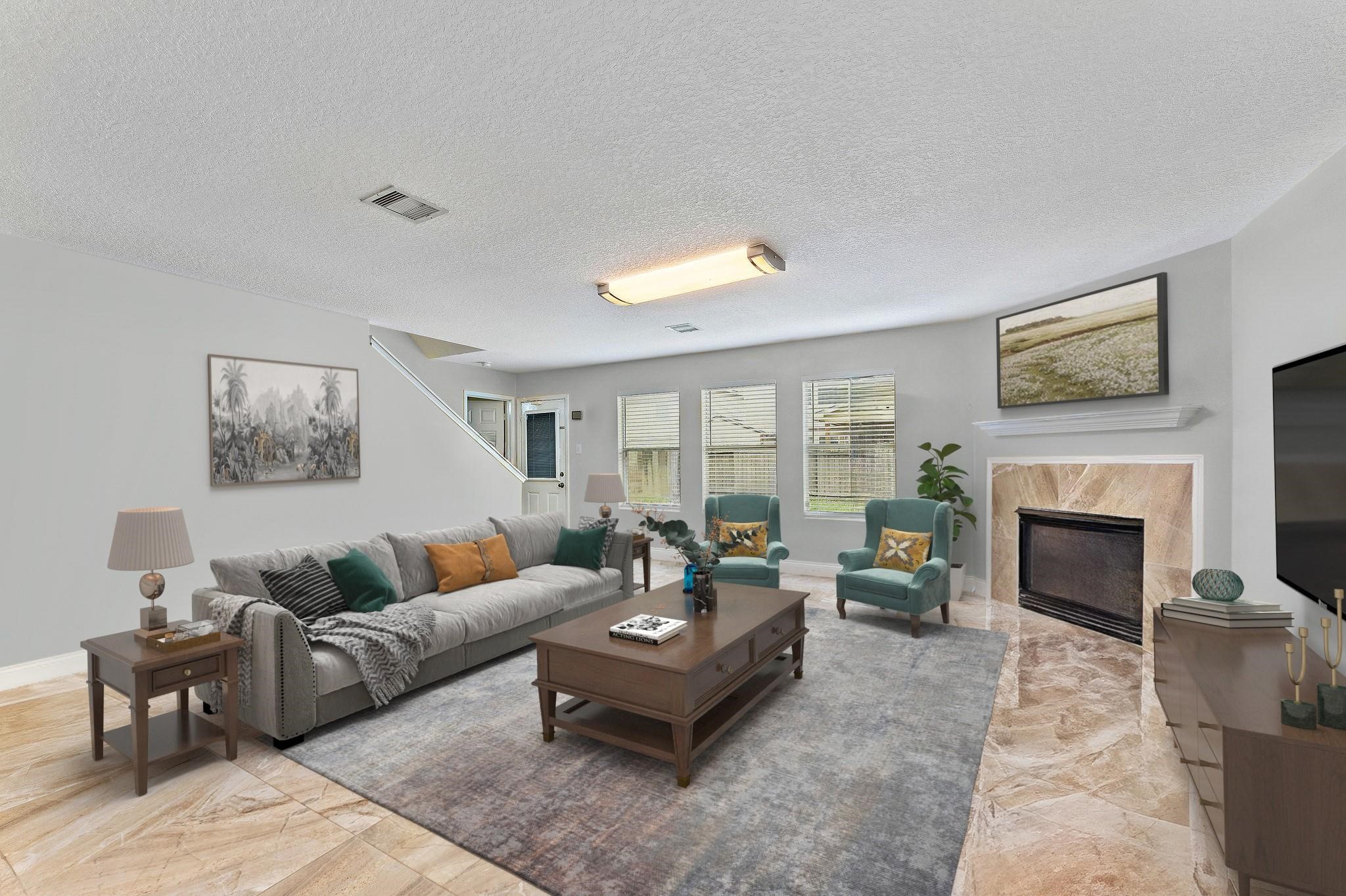 11622 Silent Elm Street Houston, TX 77044 - Photo 3 of 5 a living room with furniture and a fireplace