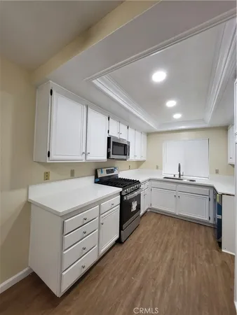 a large kitchen with cabinets