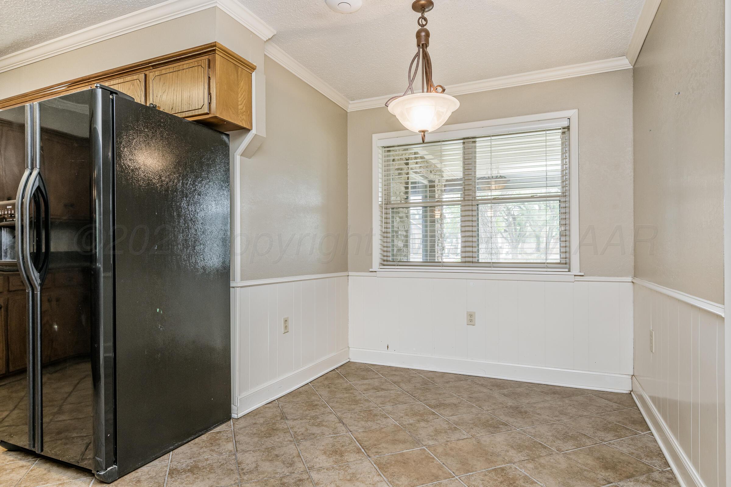 4400 West Farmers Avenue Amarillo, TX 79110 - Photo 9 of 27 a view of an empty room with a window