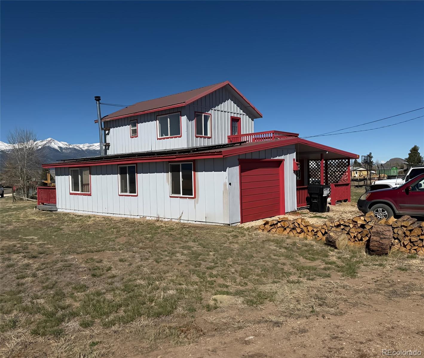 715 2nd Street Silver Cliff, CO 81252 - Photo 2 of 16 a front view of a house with a yard