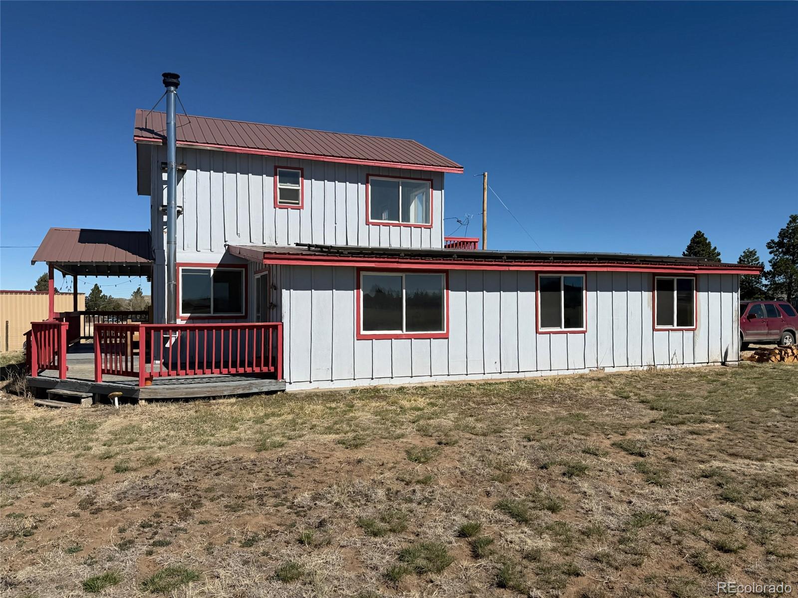 715 2nd Street Silver Cliff, CO 81252 - Photo 3 of 16 a front view of a house with balcony