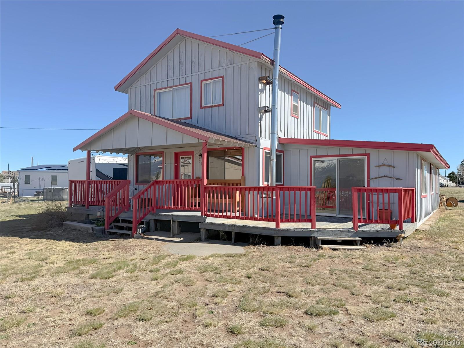 715 2nd Street Silver Cliff, CO 81252 - Photo 4 of 16 a front view of a house with garden
