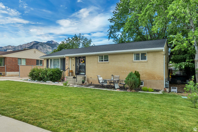 1215 8th Street Ogden, UT 84404 - Photo 3 of 39 Light-colored brick exterior with a dark shingled roof