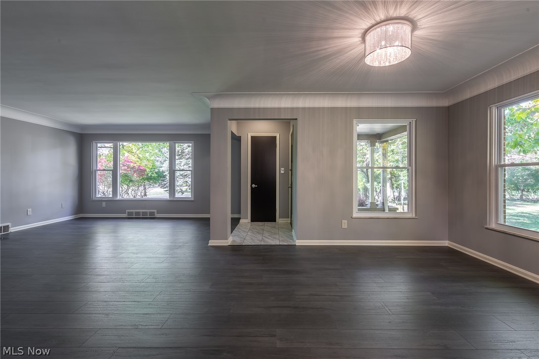 1393 Clearview Road Cleveland, OH 44124 - Photo 5 of 35 Oversized windows provide natural light that illuminates the main living and dining areas as you look from the kitchen! The foyer floor is a ceramic marble.