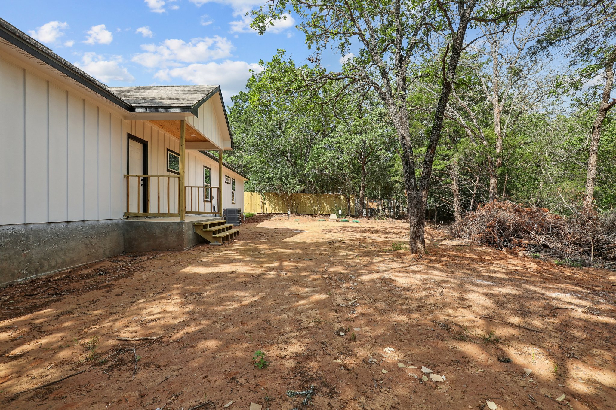 210 Flint Ridge Street Bastrop, TX 78602 - Photo 40 of 40 a view of a yard with large trees
