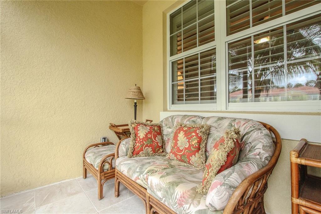 8531 Violeta Street, Unit 101 Estero, FL 34135 - Photo 15 of 23 a white couch sitting in front of a door