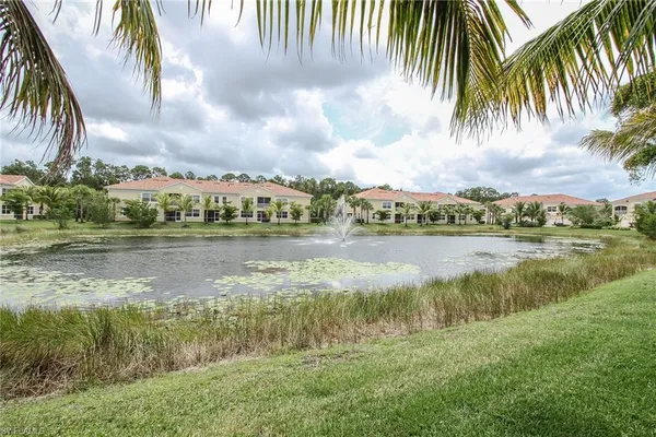 a view of a lake with houses in the background