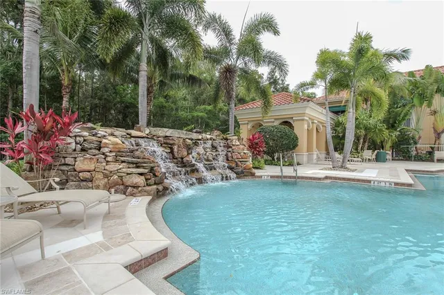 a living room with lots of furniture and a flat screen tv