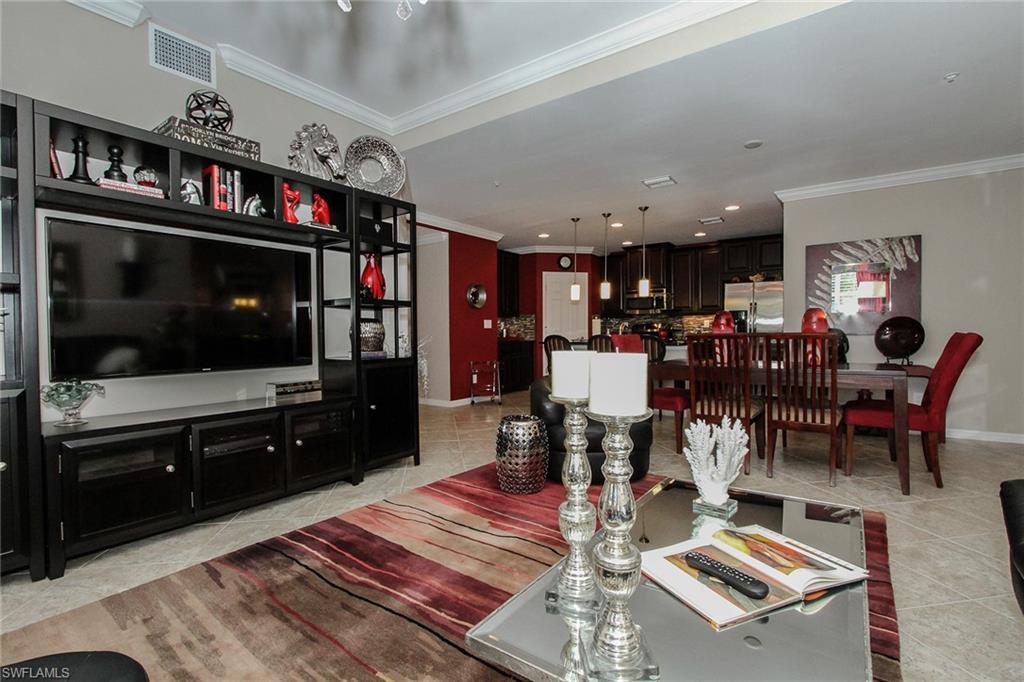 8531 Violeta Street, Unit 101 Estero, FL 34135 - Photo 4 of 23 a living room with lots of furniture and a flat screen tv