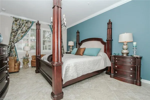 a bedroom with a bed and a night stand