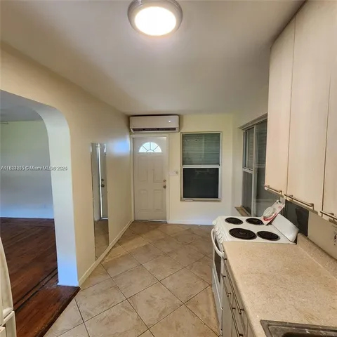 a room with a bed and a mirror