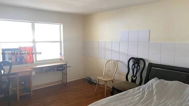 a view of a kitchen area with furniture and a window
