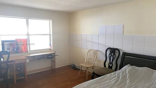 a view of a chair and table in the kitchen