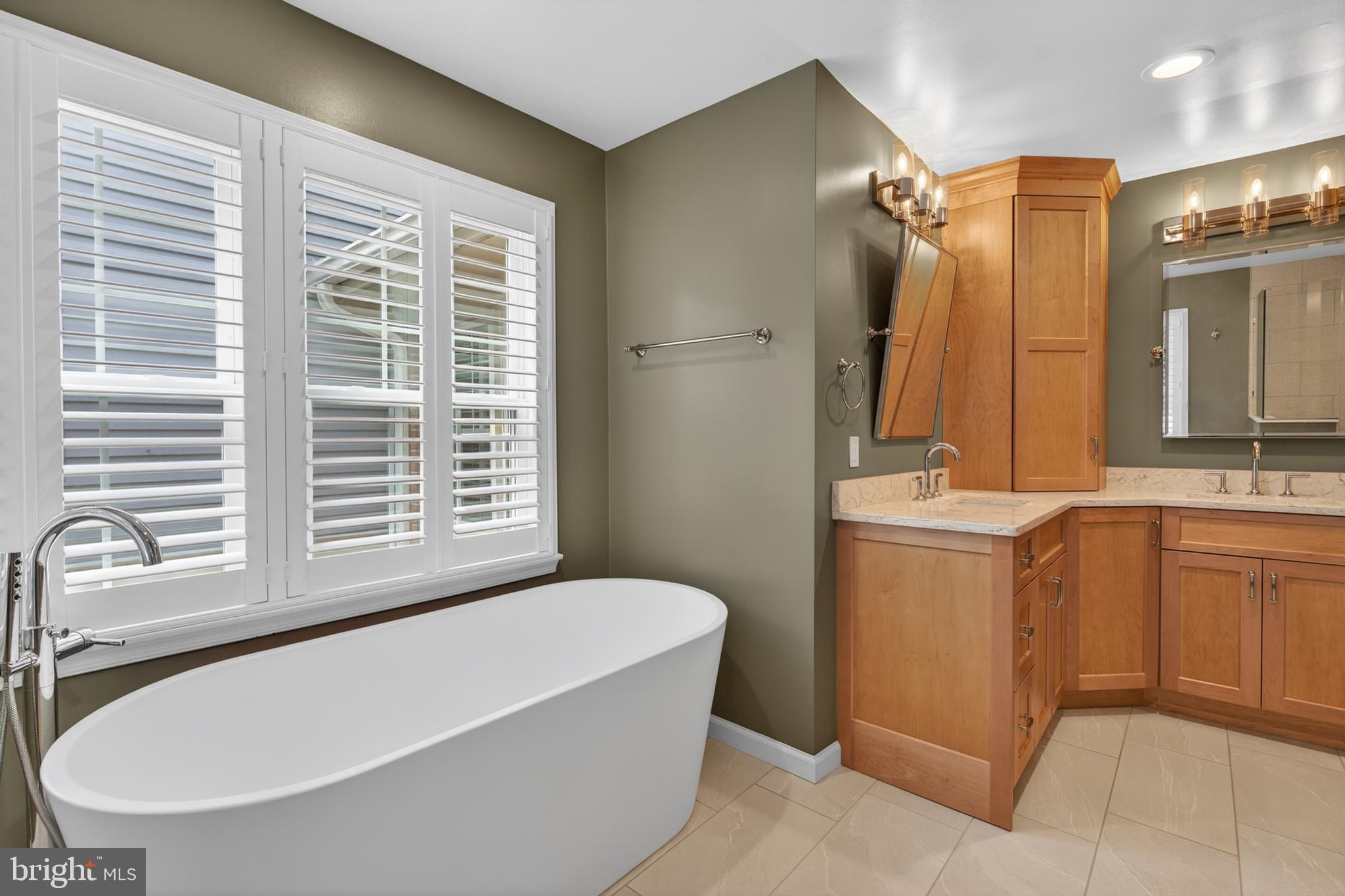 6 Nearfield Road Lutherville-Timonium, MD 21093 - Photo 46 of 71 a bathroom with a tub sink and mirror