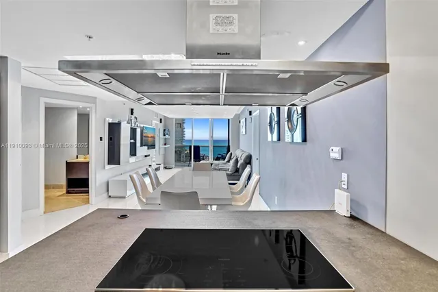 a view of a living room and chandelier