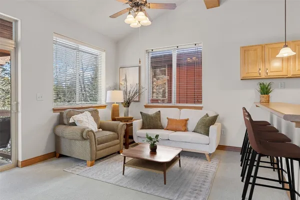 a living room with furniture and a large window