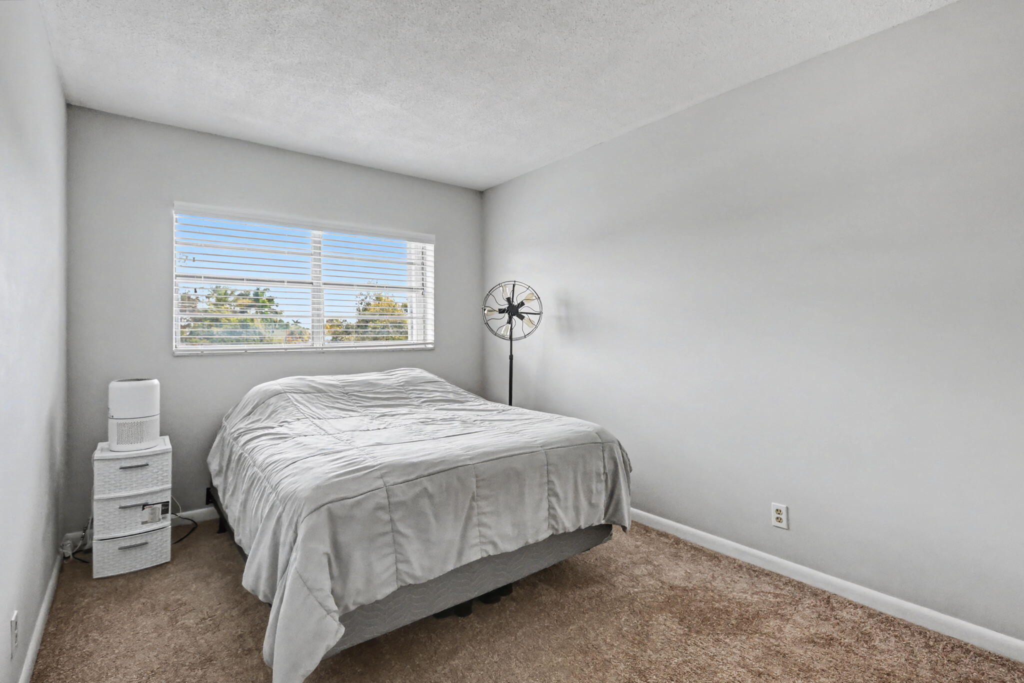 100 Royal Palm Way, Unit 303 Boca Raton, FL 33432 - Photo 17 of 35 a bedroom with a bed and a window