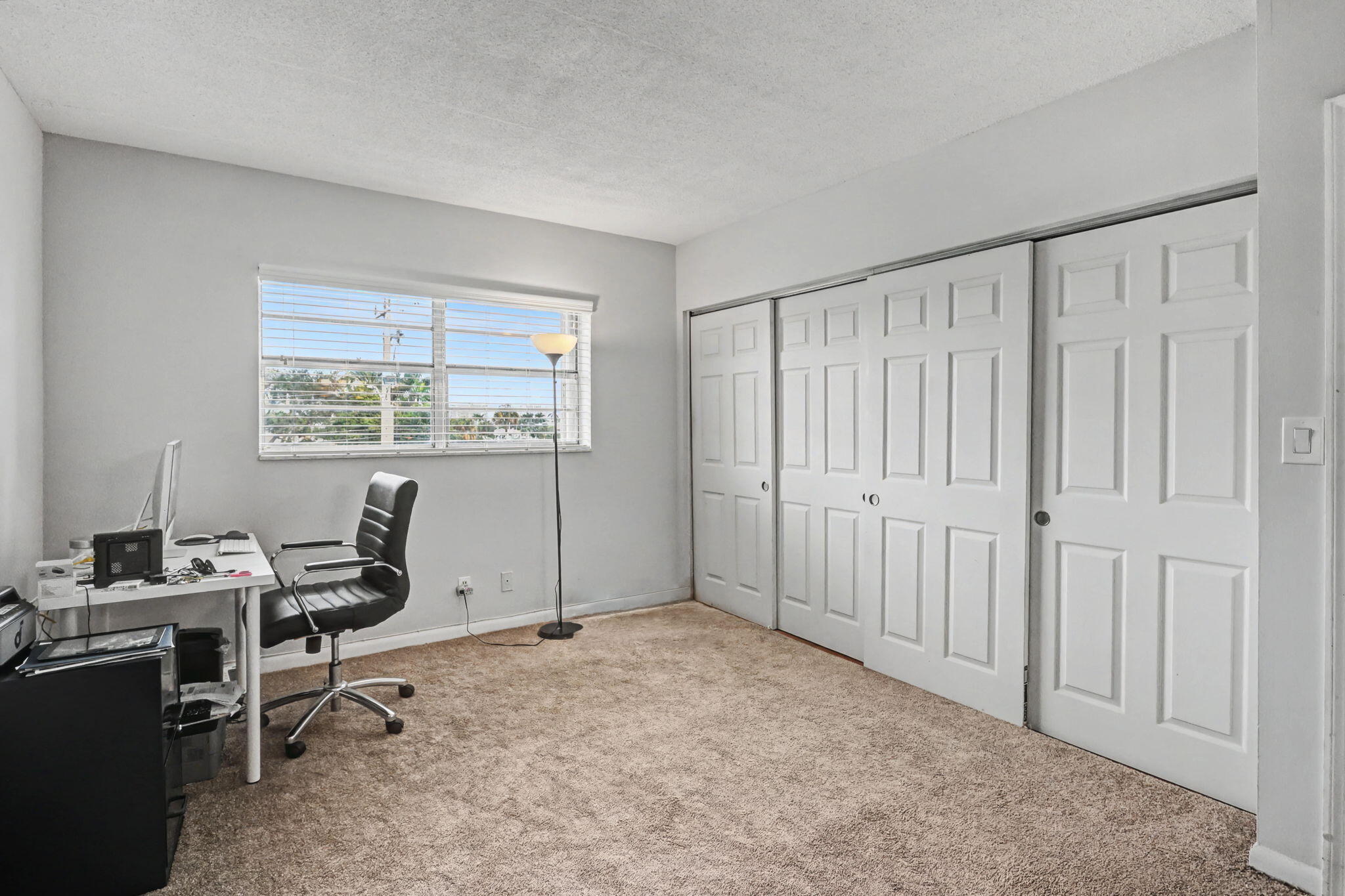 100 Royal Palm Way, Unit 303 Boca Raton, FL 33432 - Photo 21 of 35 a view of a workspace with furniture and a window