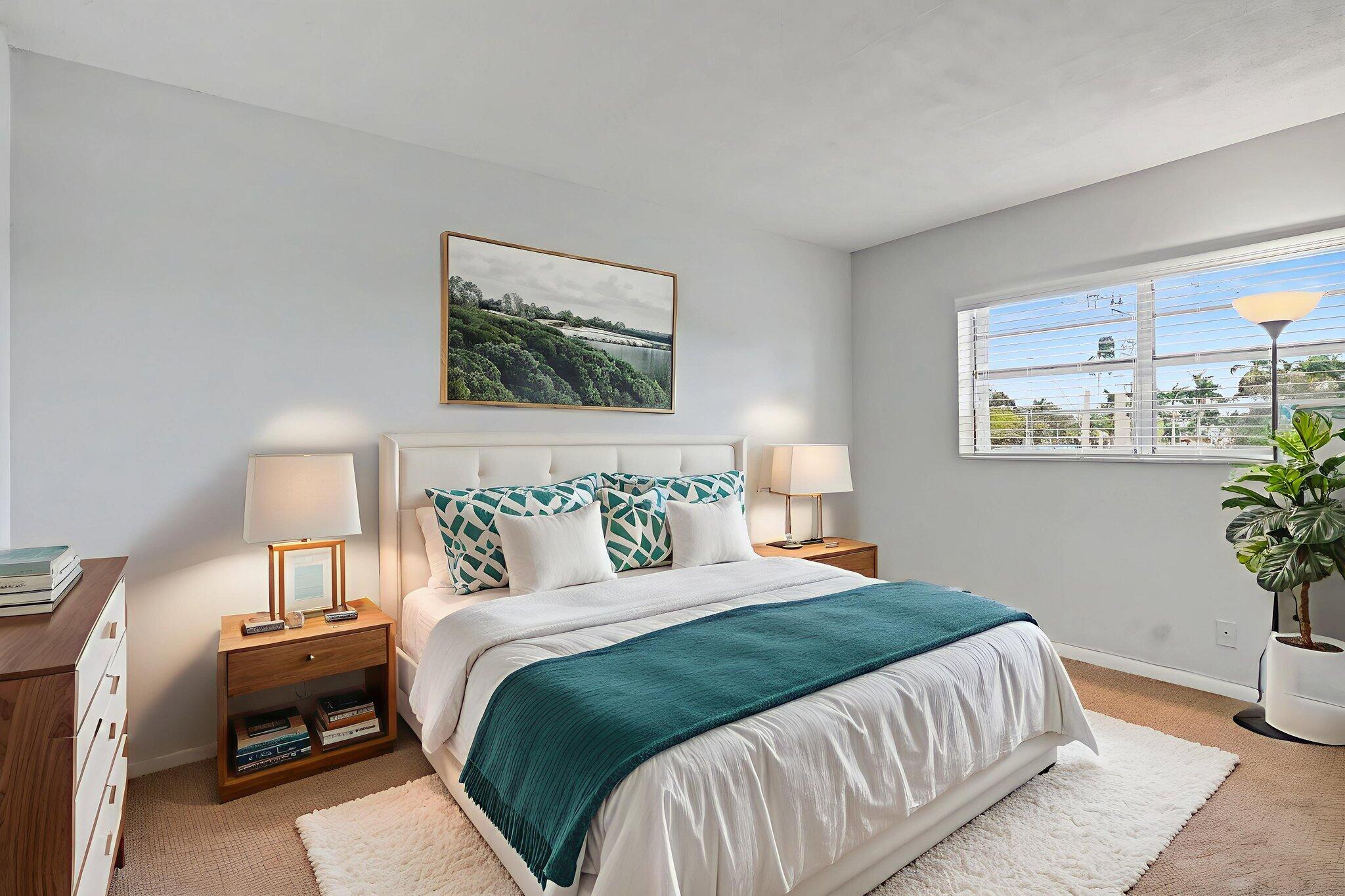 100 Royal Palm Way, Unit 303 Boca Raton, FL 33432 - Photo 23 of 35 a bedroom with a bed and a painting on the wall