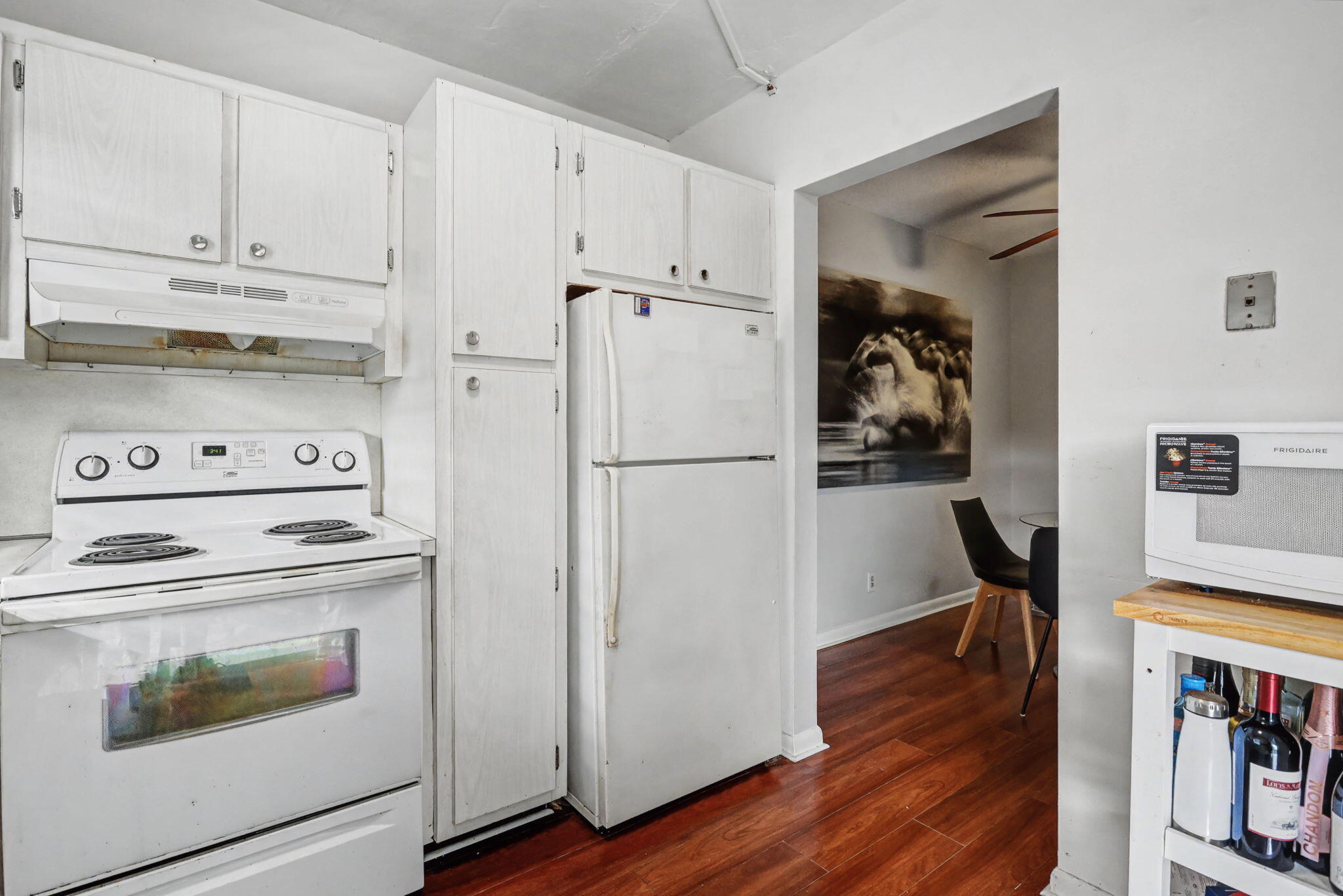 100 Royal Palm Way, Unit 303 Boca Raton, FL 33432 - Photo 7 of 35 a kitchen with stainless steel appliances a stove a refrigerator and cabinets