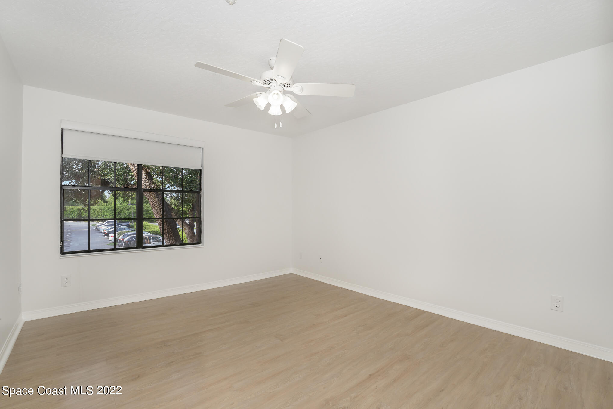 7667 North Wickham Road, Unit 113 Melbourne, FL 32940 - Photo 11 of 29 an empty room with a window