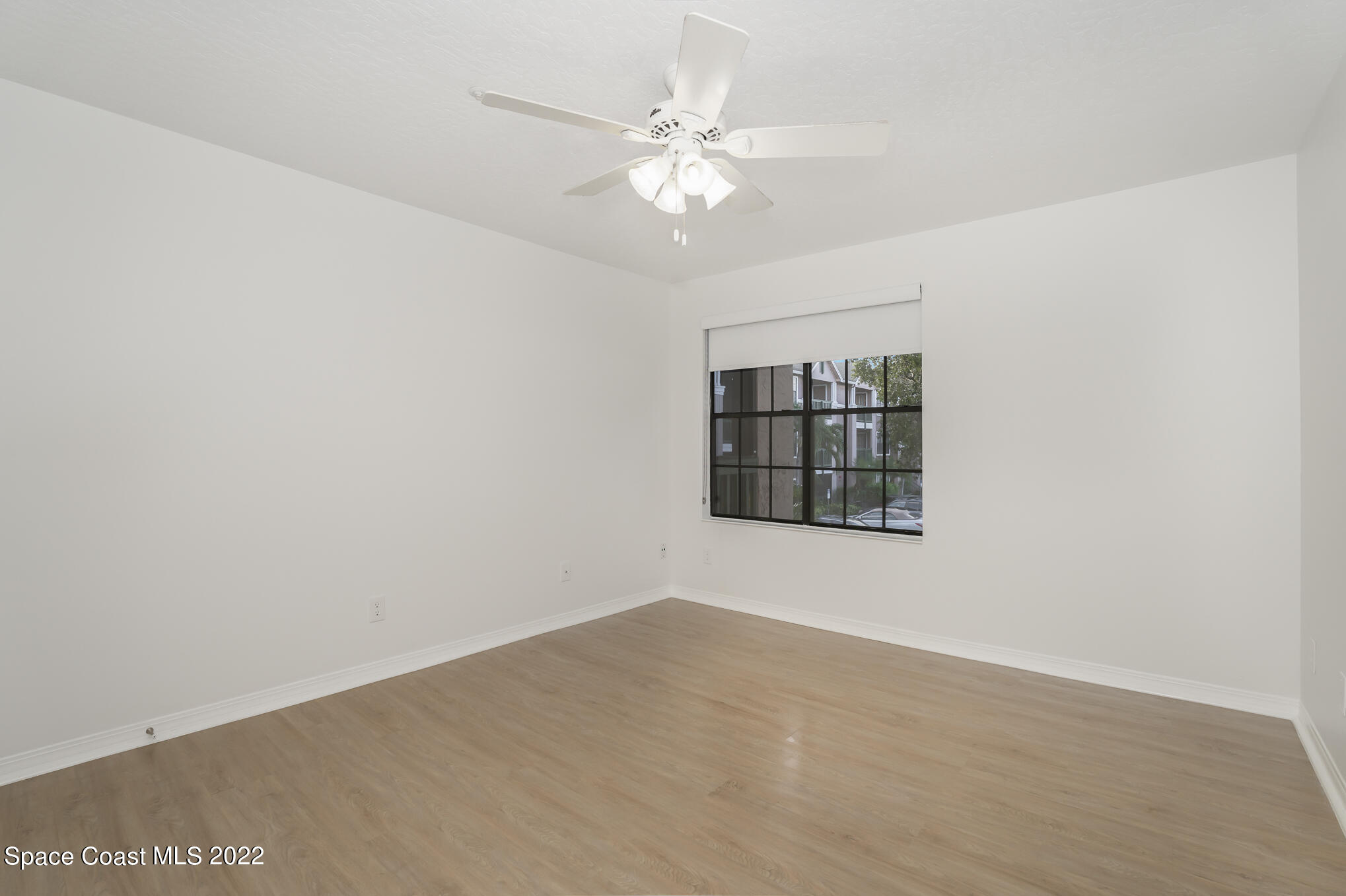 7667 North Wickham Road, Unit 113 Melbourne, FL 32940 - Photo 12 of 29 a view of an empty room with a window