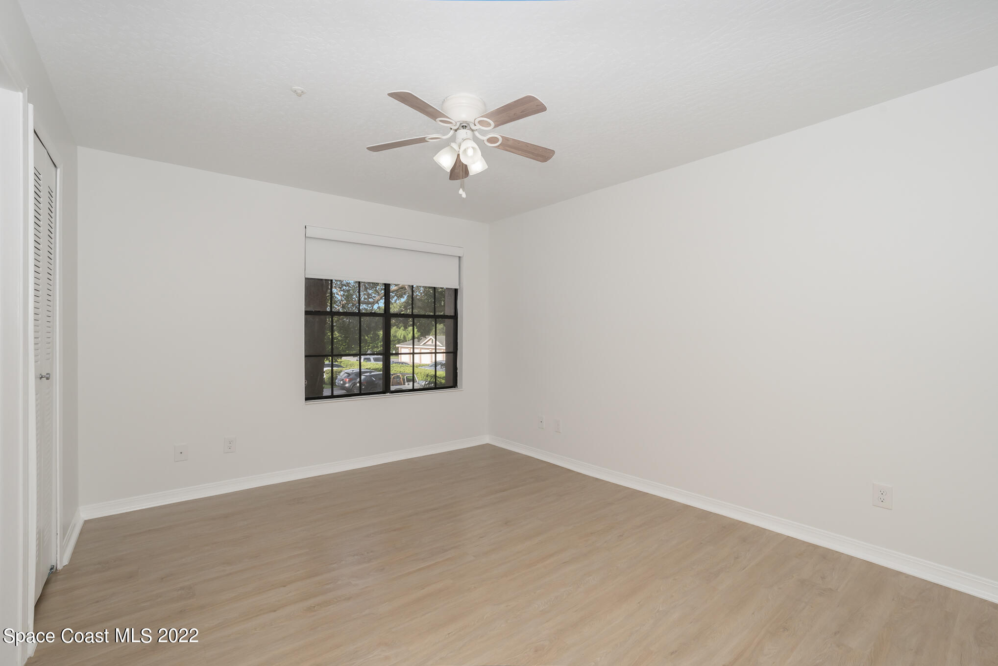 7667 North Wickham Road, Unit 113 Melbourne, FL 32940 - Photo 14 of 29 a view of an empty room with a window